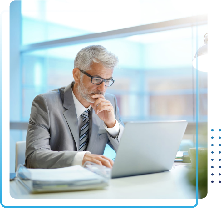 Middle aged business man working on a laptop